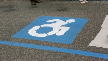 New accessible icon featuring a person using a wheelchair on an active pose.