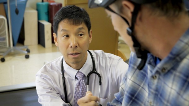 Dr. Watanabe working with a patient.