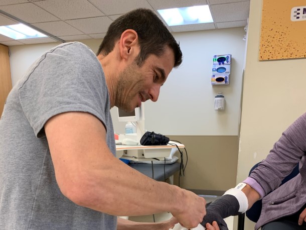 Alexey working with a patient.