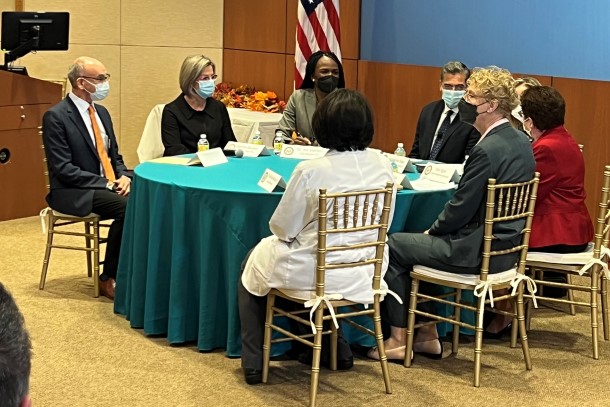 Healthcare leaders sit around a table